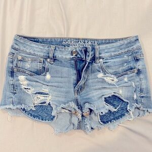 American eagle distressed blue jean shorts.
